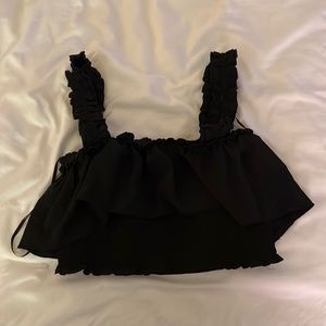 Cropped black tank top with ruffles